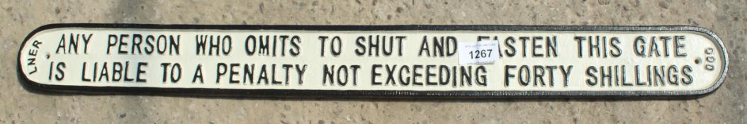 A 'SHUT THE GATE' SIGN + VAT