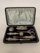 AN 1898 VICTORIAN, HALLMARKED BIRMINGHAM SILVER MANICURE SET IN A FITTED CASE