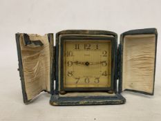AN EARLY 20TH CENTURY GERMAN KIENZLE BRASS TRAVEL CLOCK WITH CASE