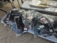 A SHELF OF CHEFS SHIRTS