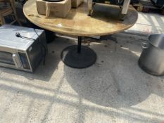 A ROUND BANQUET TABLE ON METAL PEDESTAL