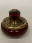 A HEAVY VINTAGE RUBY GLASS AND BRASS INKWELL