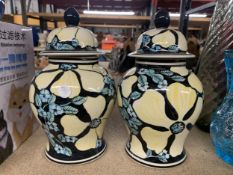 A PAIR OF LARGE DECORATIVE GINGER JARS
