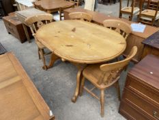 A PINE TWIN PEDESTAL DINING TABLE, 54" X 38" AND FOUR VICTORIAN STYLE PIERCED SPLAT BACK CHAIRS