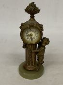 A VINTAGE, PROBABLY FRENCH, FIGURAL COLUMN BRASS CLOCK WITH ENAMELLED FACE AND ONYX BASE, HEIGHT