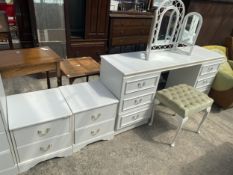 A WHITE TWIN PEDESTAL DRESSING TABLE, STOOL AND A PAIR OF MATCHING BEDSIDE CHESTS