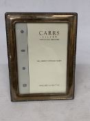 A HALLMARKED SHEFFIELD SILVER PHOTO FRAME, 21CM X 16CM