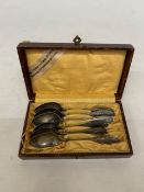A SET OF SIX XRF TESTED TO 99.7% SILVER SPOONS IN A CASE, WEIGHT 139.82