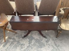 A MAHOGANY PEDESTAL DROP LEAF COFFEE TABLE