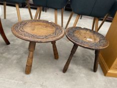 TWO CARVED OAK CIRCULAR TRIPOD STOOLS