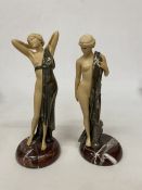 TWO ART DECO INSPIRED FIGURES OF NUDES WITH BRONZE CAPES ON A MARBLE BASE