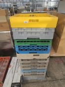A STACK OF DISHWASHER BASKETS