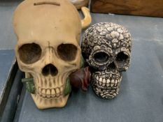 TWO DECORATIVE SKULLS