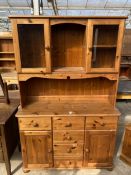 A PINE DRESSER WITH PARTIALLY GLAZED UPPER PORTION, 46" WIDE