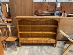 A PINE DRESSER RACK ENCLOSING FOUR DRAWERS, 60" WIDE