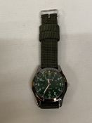 A GENTLEMAN'S 'INFANTRY' QUARTZ WATCH WITH A GREEN FACE - WORKING AT TIME OF CATALOGUING, NO