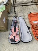 A PINK VIOLIN WITH CARRY CASE