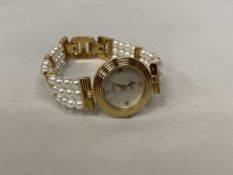 A LADIES LOTUS ROUND FACED MOTHER OF PEARL WATCH - WORKING AT TIME OF CATALOGUING, NO WARRANTY
