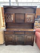 AN OAK DRESSER WITH GLAZED AND LEADED UPPER PORTION, 54" WIDE