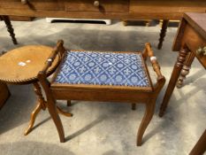 AN EDWARDIAN OAK PIANO STOOL WITH LIFT UP SEAT