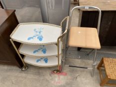A FiAM TUBULAR FOLDING HIGH STOOL AND 1970'S THREE TIER TROLLEY WITH DETACHABLE TRAYS