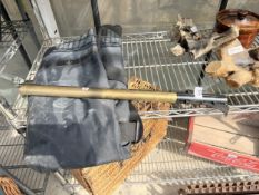 A GUN SLIP AND A BRASS RIFLE TUBE