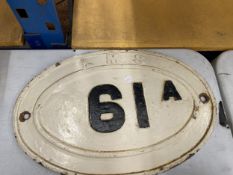 A CAST LONDON MIDLAND SCOTTISH (LMS) EDWARDIAN OVAL RAILWAY SIGN, 46CM X 30CM