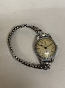 A LADIES KLAUS KOBEC ENTREPRENEUR WATCH WITH GOLD TONE STRAP - WORKING AT TIME OF CATALOGUING, NO