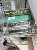 A SET OF WOODBINE DOMINOES AND THREE HARMONICAS