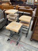 A SET OF SEVEN MID CENTURY TUBULAR STEEL FRAMED STACKING STOOLS