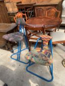 A LOW CHAIR AND STOOL ON TUBULAR METAL FRAME