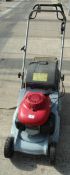 A HONDA LAWN MOWER WITH FULL SERVICE AND 3 NEW CABLES IN WORKING ORDER NO VAT