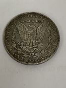 AN 1878 SILVER AMERICAN DOLLAR