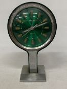 A VINTAGE 1960'S, CORAL SPACE AGE 'TULIP' PEDESTAL CLOCK WITH A TRANSLUCENT GREEN FACE ON A CHROME