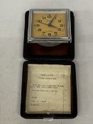 A VINTAGE RUSSIAN SLAVA CASED TRAVEL ALARM CLOCK