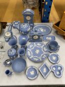 A LARGE QUANTITY OF WEDGWOOD JASPER WARE TO INCLUDE, TEAPOTS, CLOCKS, A CUP AND SAUCER, PIN TRAYS,