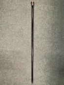 A VINTAGE WALKING CANE WITH A DARK EBONIZED WOODEN SHAFT AND HALLMARKED BIRMINGHAM SILVER HANDLE