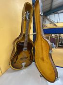 AN ARTISAN ELECTRIC GUITAR WITH A HARD CASE - REPAIR TO THE HEADSTOCK