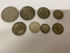 A QUANTITY OF HALF SILVER COINS