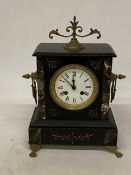 A VINTAGE HEAVY SLATE CHIMING MANTLE CLOCK WITH BRASS HANDLES AND KEY