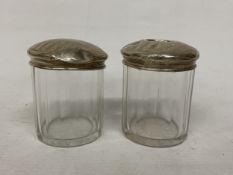 TWO GLASS AND HALLMARKED BIRMINGHAM SILVER DRESSING TABLE JARS