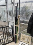AN ASSORTMENT OF VARIOUS FISHING RODS AND A BROLLY
