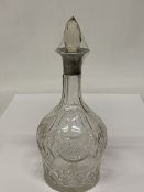 A HALLMARKED SHEFFIELD SILVER TOPPED GLASS DECANTER