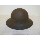 A WORLD WAR II PAINTED ZUCKERMAN HELMET