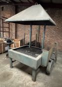 A SCRATCH BUILT METAL WORKING FORGE BELIEVED WORKING BUT NO WARRANTY IS GIVEN