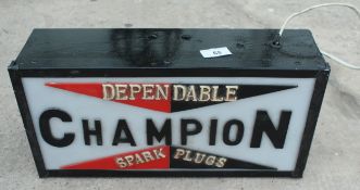 AN ILLUMINATED CHAMPION SPARK PLUGS SIGN NO VAT