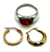 Two 9ct gold earrings (1g) along with silver ring set with amber.