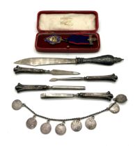 A cased Oddfellows silver medal along with a collection of silver handled items and a Victorian