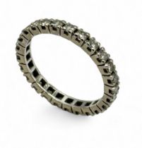 An 18ct white gold eternity ring set with diamonds - size O 1/2, weight 2.67g