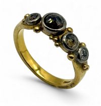 An 18ct gold champagne diamond four stone ring - size N 1/2, weight 4.99g